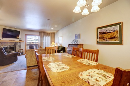 Large dining room table that opens up nicely to the kitchen and living area.