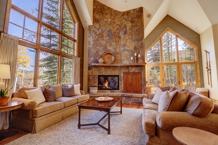 The main living room features cozy seating and a great fireplace.