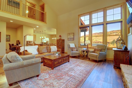 Beautiful living room featuring large windows allowing ample natural light to come in.