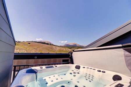 Private rooftop deck offers a hot with beautiful mountain views.