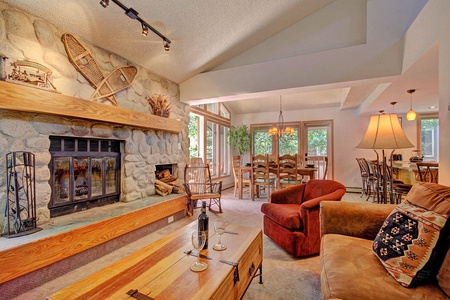 Living room with wood burning fireplace Living area features wood burning fireplace.