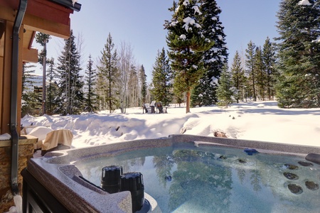 The home features a large private hot tub in the backyard.