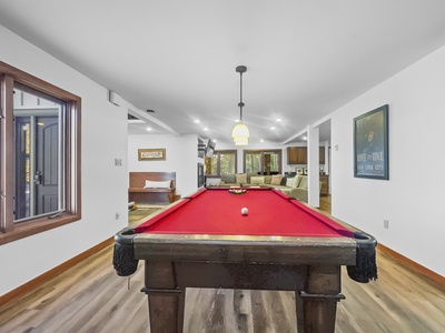 Lower level features a large private pool table.