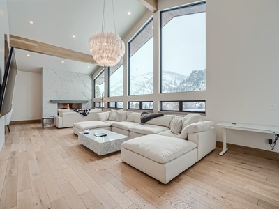 The spacious living room flooded with natural light