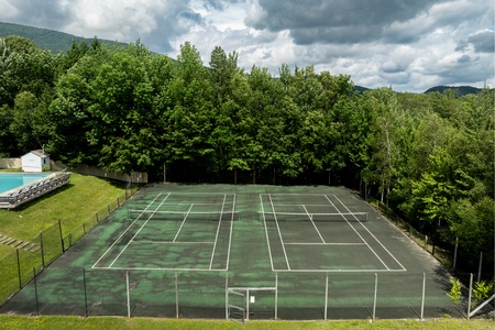 - Private tennis courts nestled among lush trees and mountain views   - Space for friendly matches and fun family competition   - Stay active with outdoor recreation right outside your stay