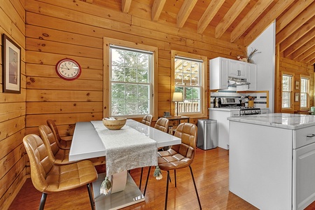 Open dining area with a large table—perfect for shared meals, games, or other gatherings.