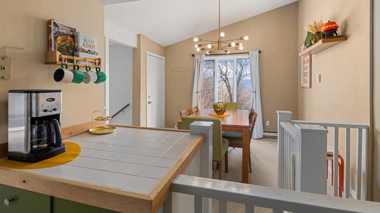 The kitchen opens into the dining room, ideal for socializing while cooking and dining