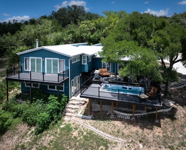 Tree-covered deck with swim spa