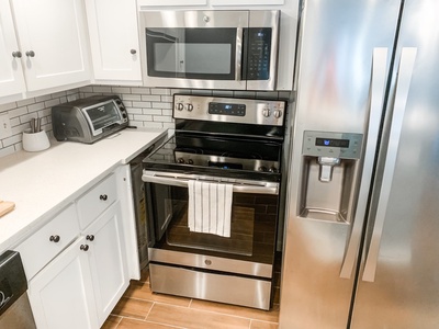 Kitchen comes with full fridge/freezer and oven with induction stove-top!