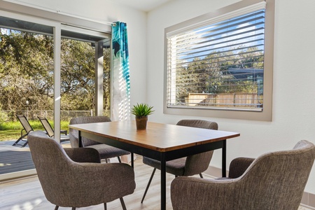 Dinette table in sunroom.  Enjoy meals with plenty of sunlight while staying cool inside