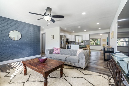 Elegant decor in the living room that opens to the kitchen and back sunroom