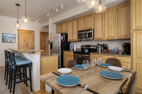 A modern kitchen with granite counter tops, stainless steel appliances,  and lots of cabinet space