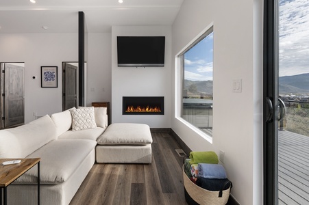 Cozy living area with views and a gas fireplace to set the mood