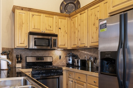 - Fully equipped kitchen with modern appliances and rustic cabinetry   - Stainless steel design makes cooking feel simple and stylish   - Perfect for preparing meals after days exploring trails and slopes