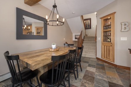 Dining area with a large wooden table for six, the perfect place for a great card game or your evenings dining in!