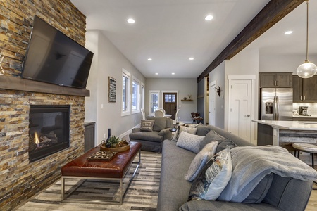 - Comfortable living area featuring plush sofas and rustic fireplace   - Perfect place for family movie nights after skiing or snowboarding   - Inviting Colorado home designed for group gatherings and relaxation