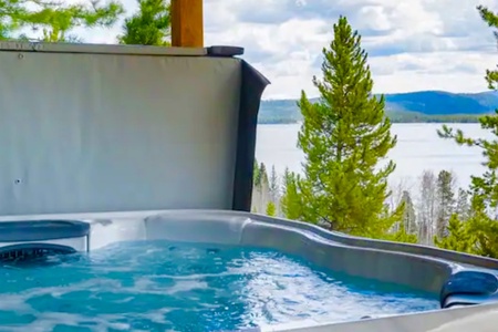 Relax in the hot tub while enjoying peaceful lake views and a star-filled sky.