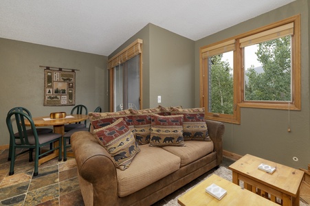 Living room with beautiful forest views right outside the window