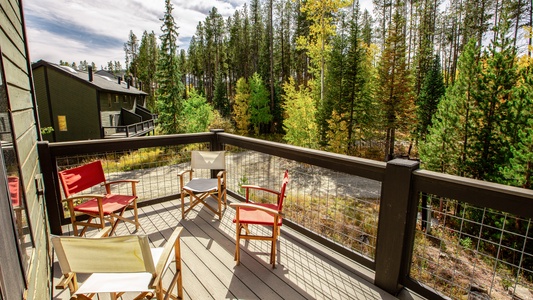 An deck outside the dining room with outdoor seating, a lovely place to soak up the sunshine or gaze at the starlit sky