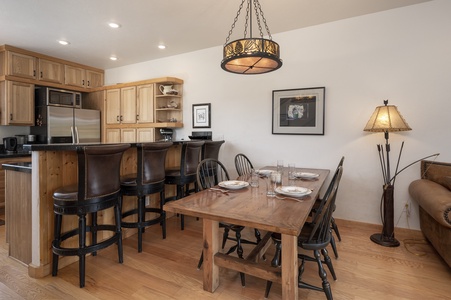 Open concept living dining area with plenty of seating for the whole bunch