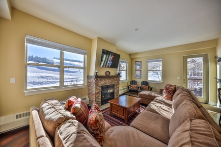 Bottom Floor corner unit with great natural light and step out the patio door to the lift.