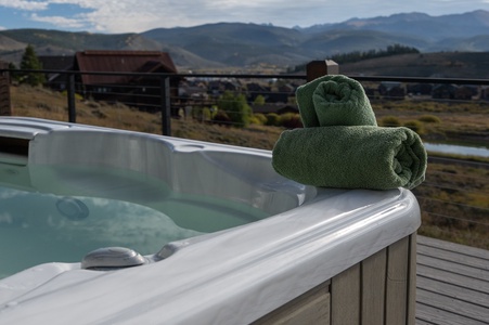 Private hot tub on spacious deck with stunning views of the mountains