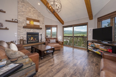 Spacious Living Room with a cozy fireplace and stunning views