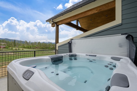 Relax in the private tub with mountain views!