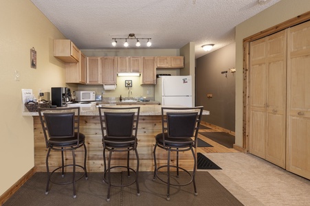 There is a breakfast bar with stools to help you get your mornings underway!