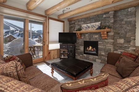 Downstairs Second Living Room with sliding glass doors leading to the covered private hot tub, and stunning views