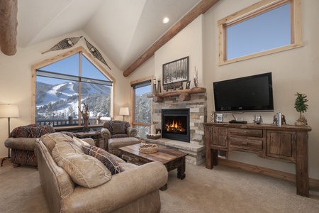 Mountain views from the cozy living room with gas fireplace