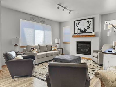 Kick off your hiking boots and relax in the cozy living room around the fireplace