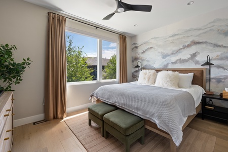 Soak in the mountain scenery and warm light from the comfort of your bed