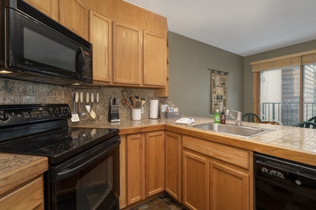 Fully equipped kitchen with microwave and stove