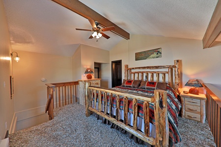 King Bed in Master Loft with a ceiling fan