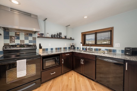 A cool modern style kitchen stocked with all your needs