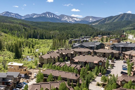 Trailhead Lodge from above with mountain views and walkability