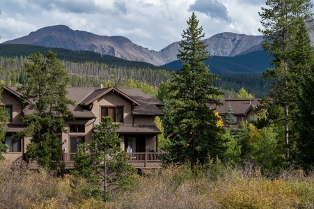 Exterior view of the rear of the home with the mountain landscape out back