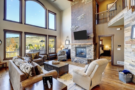 Large Open floor plan with gas fireplace and panoramic mountain views