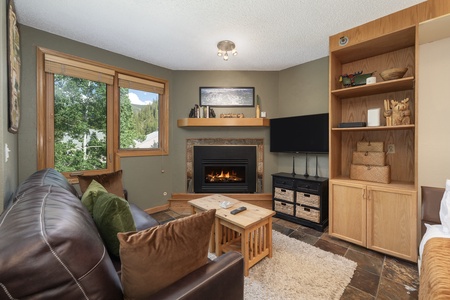 A cozy living room with soft lighting, comfy pillows, and a warm, inviting vibe