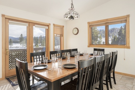 Dining Table for 10, surrounded by large windows with views, allowing the space to be soaked in natural light