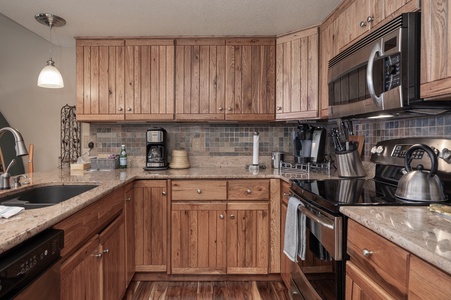 A cool and modern kitchen stocked with all your cooking needs