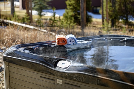 Relax in the private hot tub after a long day out adventuring