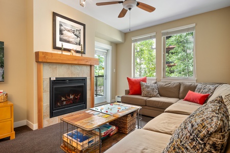 Living area boasting gas fireplace and a large sectional pullout couch