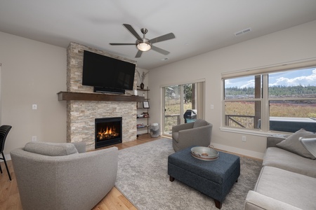 Relax by the gas fireplace with open living area.