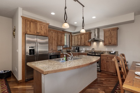 The kitchen has a spacious island with granite counter tops for all of your meal prepping needs.