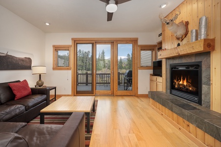 Cozy Living Room with Gas Fireplace and sliding glass windows leading to the views