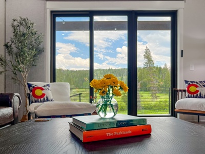 - Savor quiet mornings with mountain views through floor to ceiling windows and fresh flowers at your fingertips - Soft chair with a Colorado pillow invites you to sit back with a book or cup of coffee - Every moment here feels like a peaceful pause in na