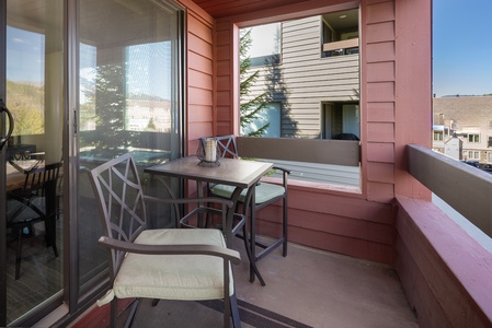 A covered balcony with outdoor seating, A perfect place to watch the afternoon rain showers