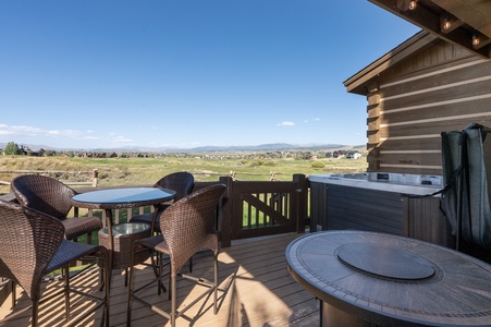 - Private deck with seating, high-top table and hot tub   - Relax while enjoying mountain views and open skies   - Perfect outdoor space for dining, drinks and sunsets